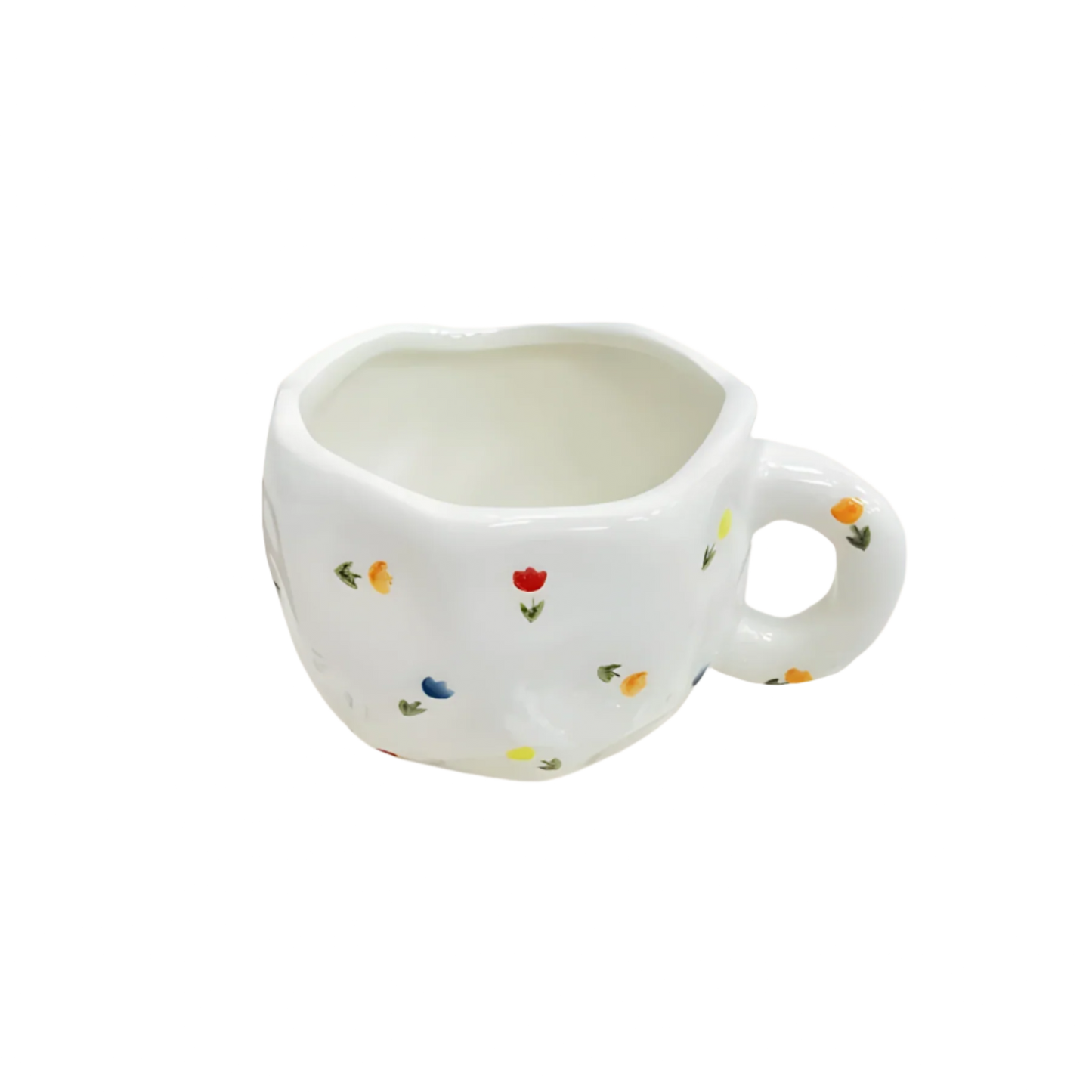 a ceramic white based mug with multiple small sparkles of red, yellow and blue flowers and green stems on it product