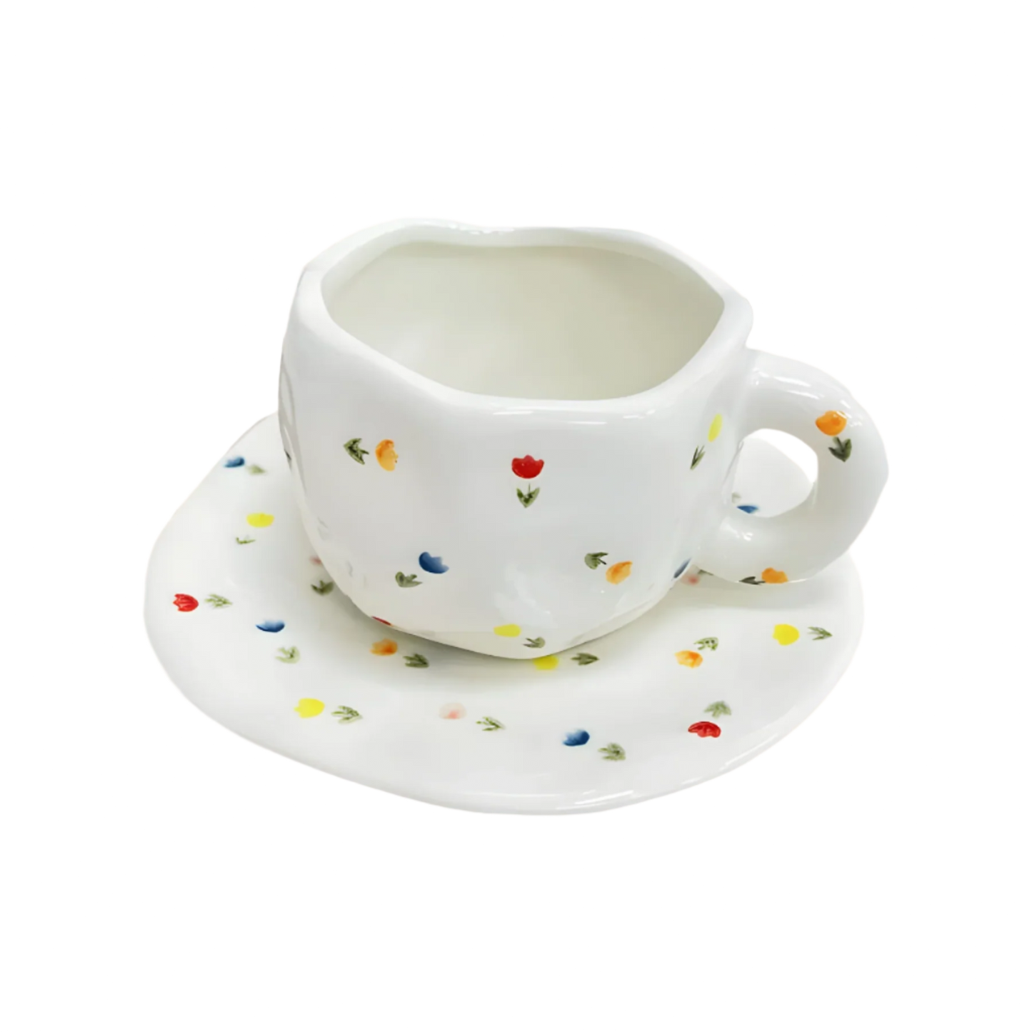 a ceramic white based mug with multiple small sparkles of red, yellow and blue flowers and green stems on it and a saucer product