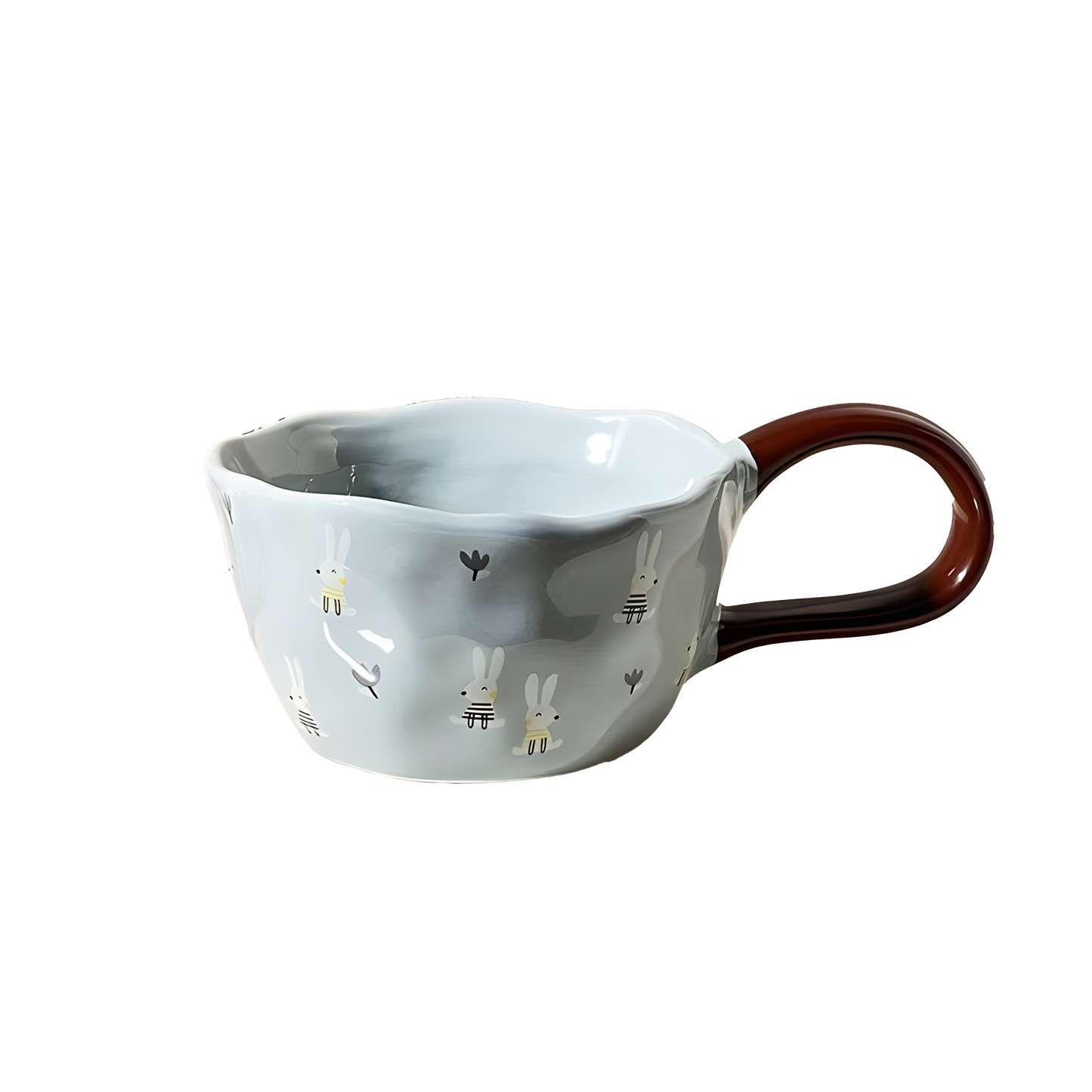 a blue bunny and tulip patterned ceramic mug with brown big loop handle product photo